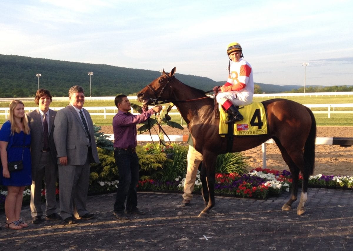 Stephanie, William, and Jeff Ramsey smile for victorious Bobby's Kitten after the Penn Mile. Photo by The Racing Biz. ramseysbobbyskitten